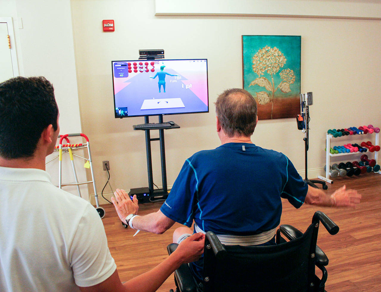John Oleson practices his mobility and strength building through a therapeutic game on Jintronix, Aug. 2. (Sophie Bonomi/Kitsap News Group)