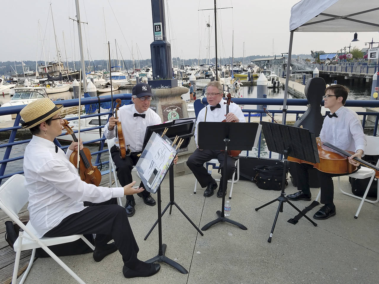 The Take Four String Quartet entertained guests as they came aboard as well as on the fantail later in the evening.                                Terryl Asla/Kitsap News Group