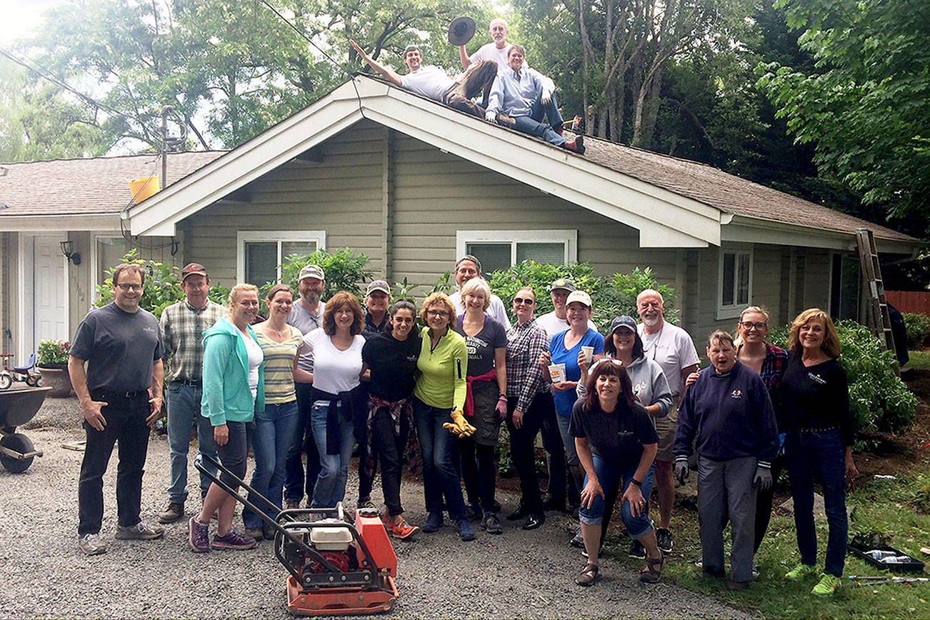 Windermere Real Estate’s Poulsbo office spent June 9 at Eli’s Place, which provides supportive housing for domestic violence survivors. The volunteers cleaned the roof, painted, landscaped the grounds, and made interior repairs. (Contributed photo)