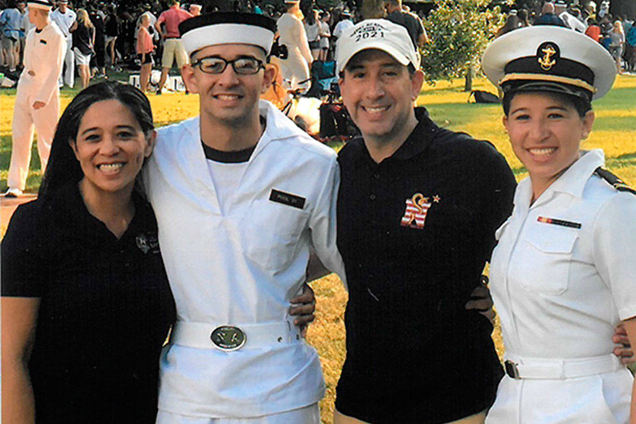 From left, Andrew Pool’s mom, Cathy Quitania-Pool (a graduate of Olympic High School); Andrew Pool; his dad, Jock Pool; and his sister, Midshipman Natalie Pool. Contributed photo