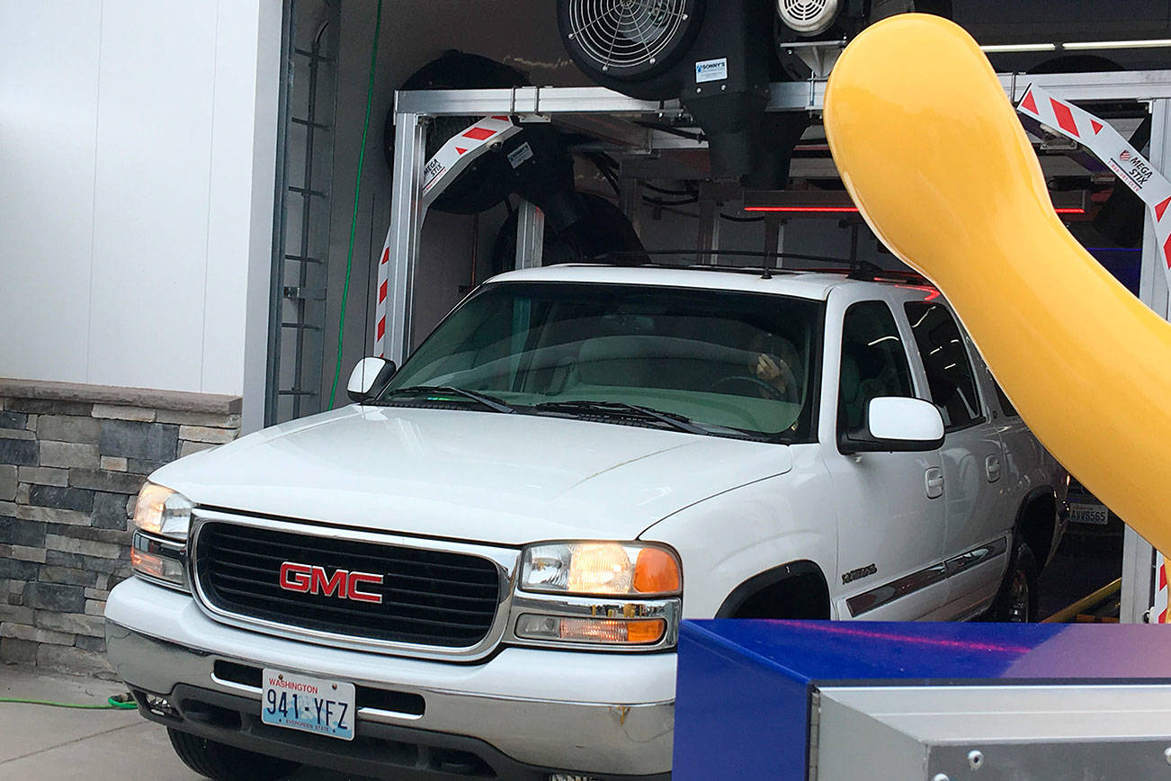 The first vehicle to get a wash when Brown Bear Car Wash opened in in June in Poulsbo. (Bill McDonald/Kitsap News Group)