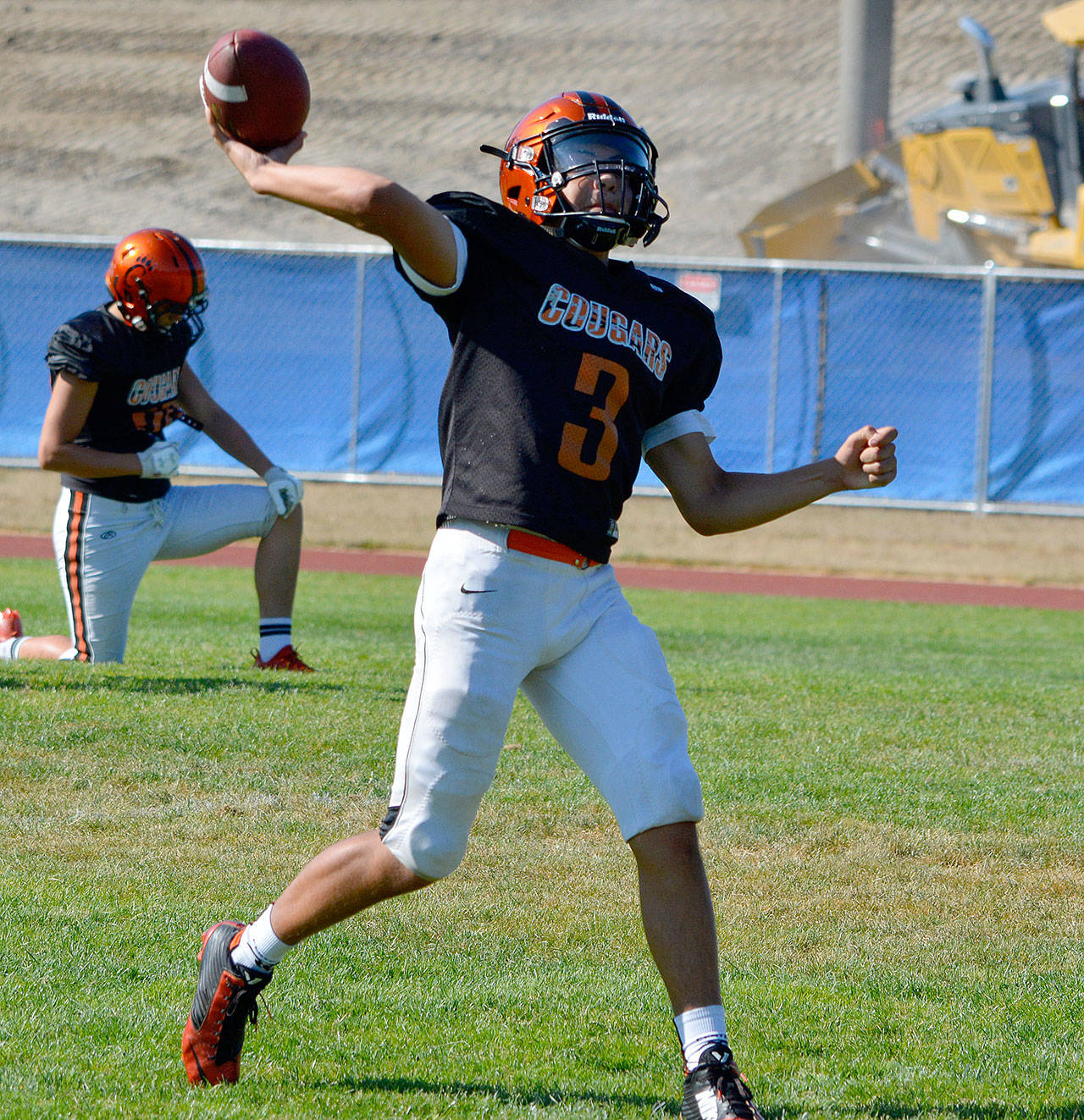 Central Kitsap quarterback Angel Davilla throws the ball down the field during a late-August practice.