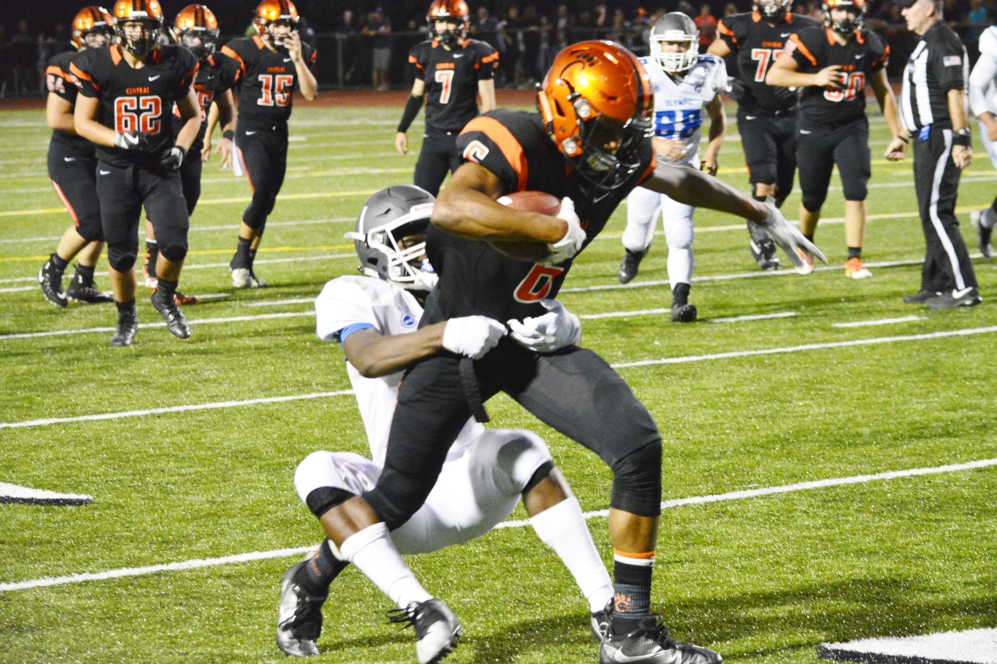 Sophomore receiver Ja’Quirious Conley is tackled by the defense after a 13-yard reception. (Mark Krulish/Kitsap News Group)