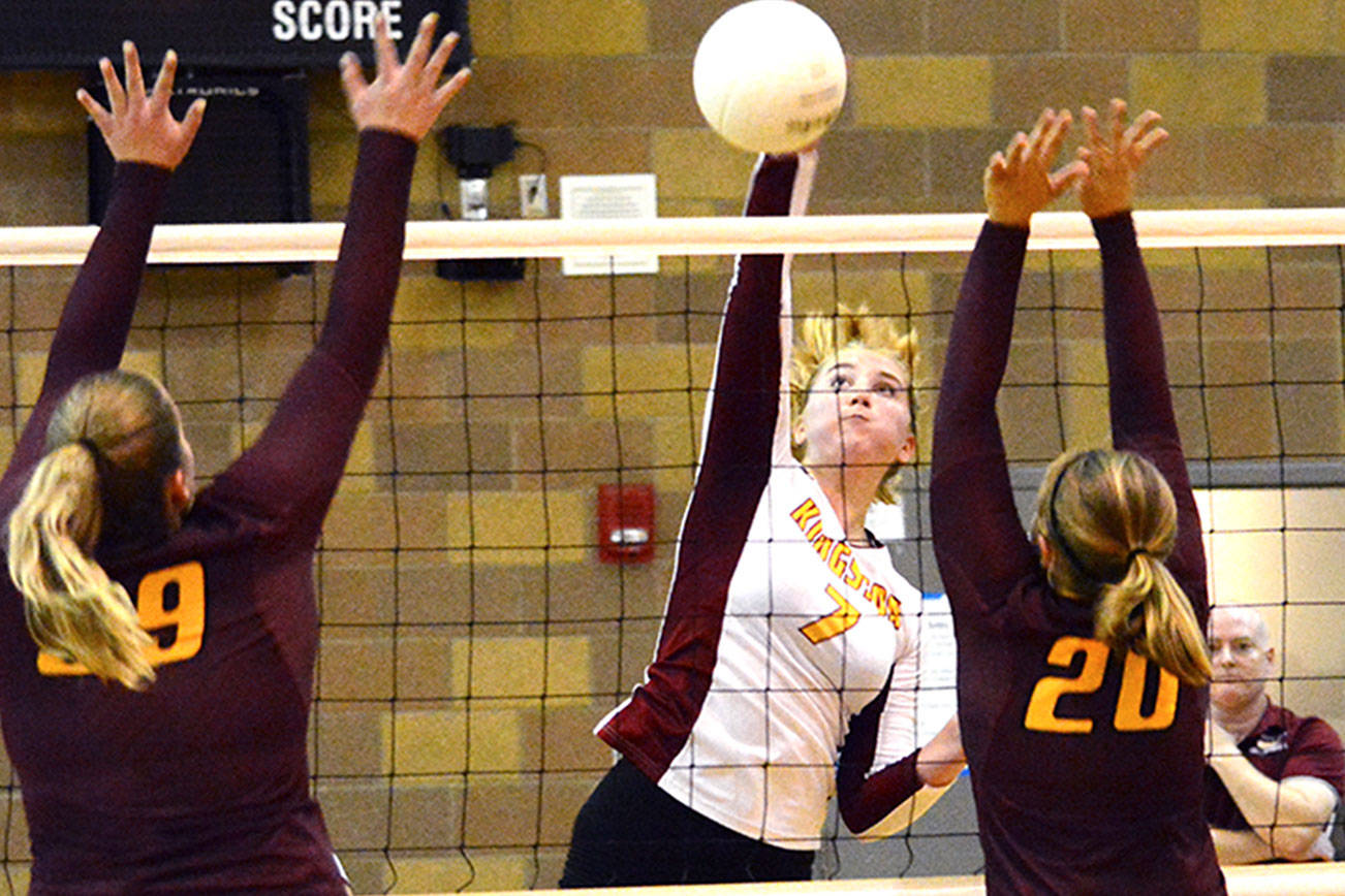 Kingston’s Ava McCabe (7) goes up for the spike against South Kitsap’s Sarah Carlson (39) and Alison Cole (20). Mark Krulish/Kitsap News Group                                 Kingston’s Ava McCabe (7) goes up for the spike against South Kitsap’s Sarah Carlson (39) and Alison Cole (20). Mark Krulish/Kitsap News Group