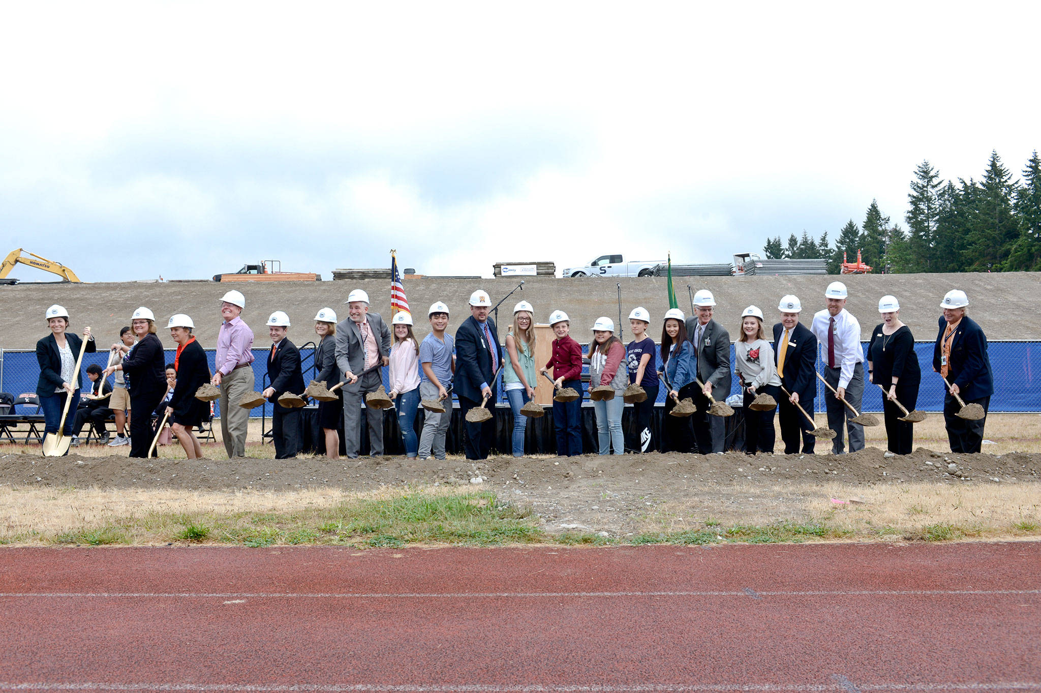 The ceremonial shoveling of dirt rounds out the groundbreaking ceremony Sept. 9 for the new Central Kitsap High and Middle Schools campus.                                Courtesy CKSD