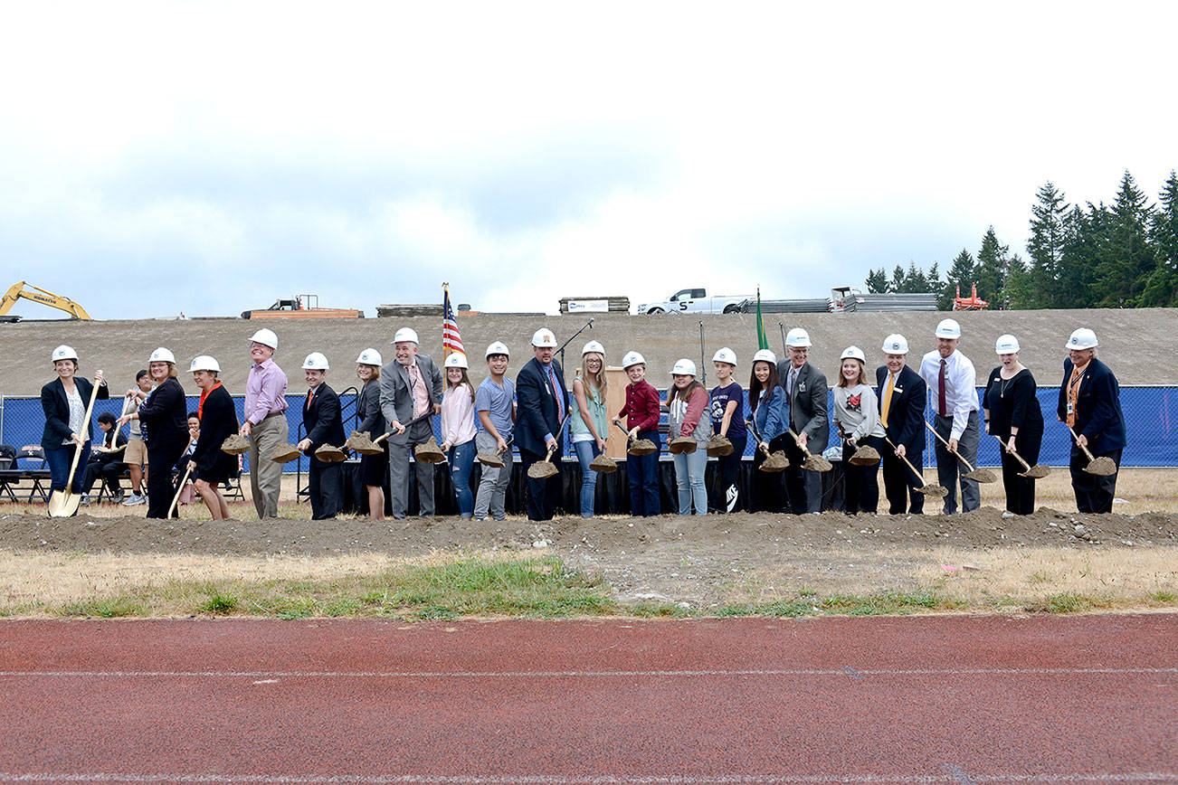 The ceremonial shoveling of dirt rounds out the groundbreaking ceremony Sept. 9 for the new Central Kitsap High and Middle Schools campus.                                Courtesy CKSD
