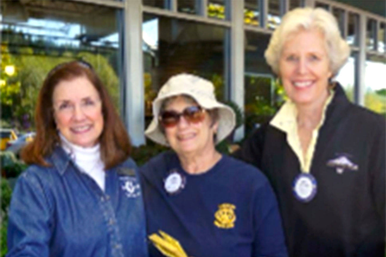 From left, Poulsbo Lion Denise Zaske and Poulsbo Rotarians Anita Blau and Cindy Garfein collect food and donations at the 2016 Lions/Rotary Food Drive for Fishline. Look for them again this weekend at Central Market, Red Apple and Walmart in Poulsbo.                                Contributed photo