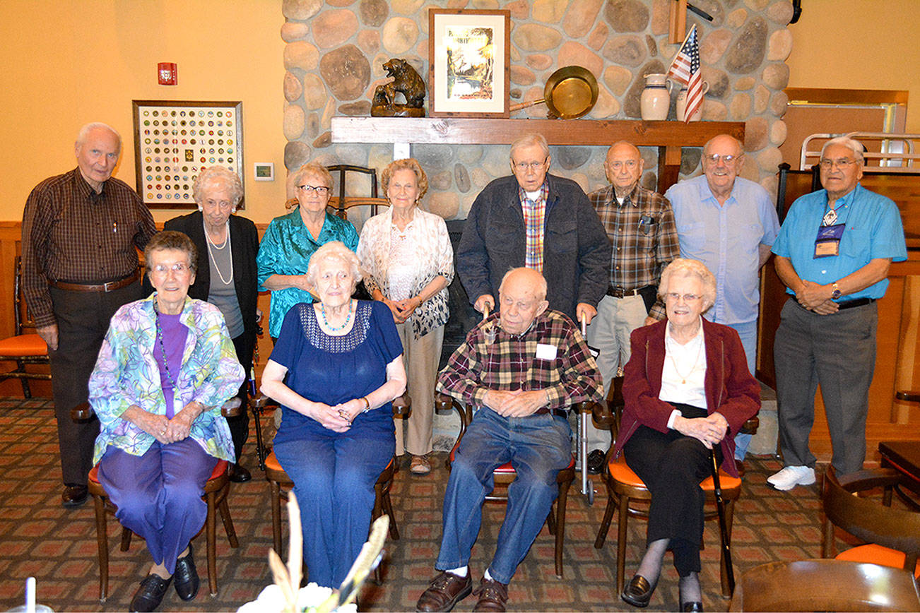 Members of the North Kitsap High School Class of 1947. Back row: Vernon Martinson, Pat Strand, Neva Rice, Louise Love, Ray Drummond, Bud Pierce, Jim Pickrell and Ted George. Bottom row: Carolynn Swearingen, Lila Brazeau, Kaare Jacobsen and Arlene Updyke.  Mark Krulish/Kitsap News Group