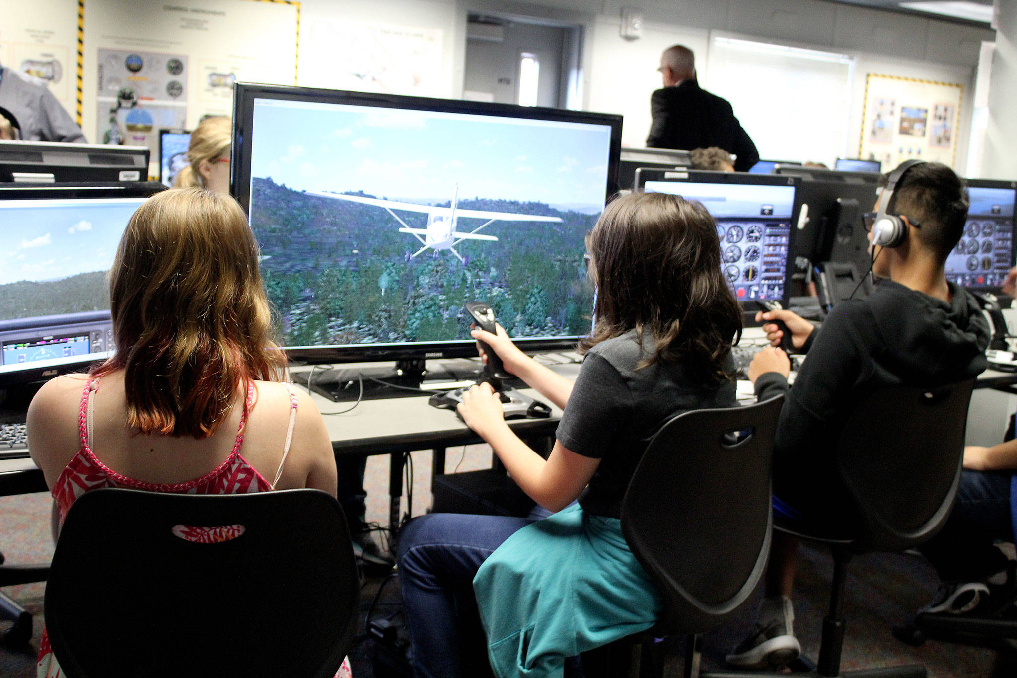 Ridgetop Middle School students learn about aviation from first-class technology that includes flight simulation programs.                                Michelle Beahm / Kitsap News Group
