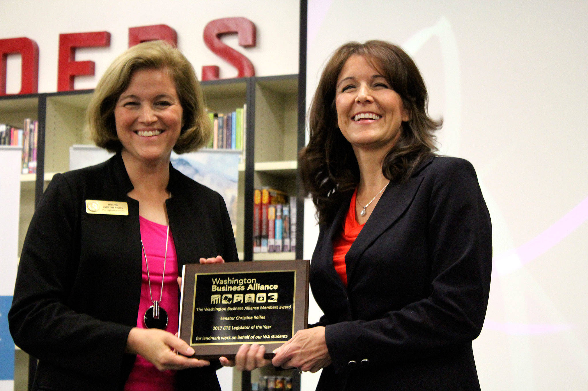 At left, Sen. Christine Rolfes, D-23rd District, accepts the 2017 CTE Legislator of the Year award from Washington Business Alliance President Colleen McAleer, right.                                Michelle Beahm / Kitsap News Group
