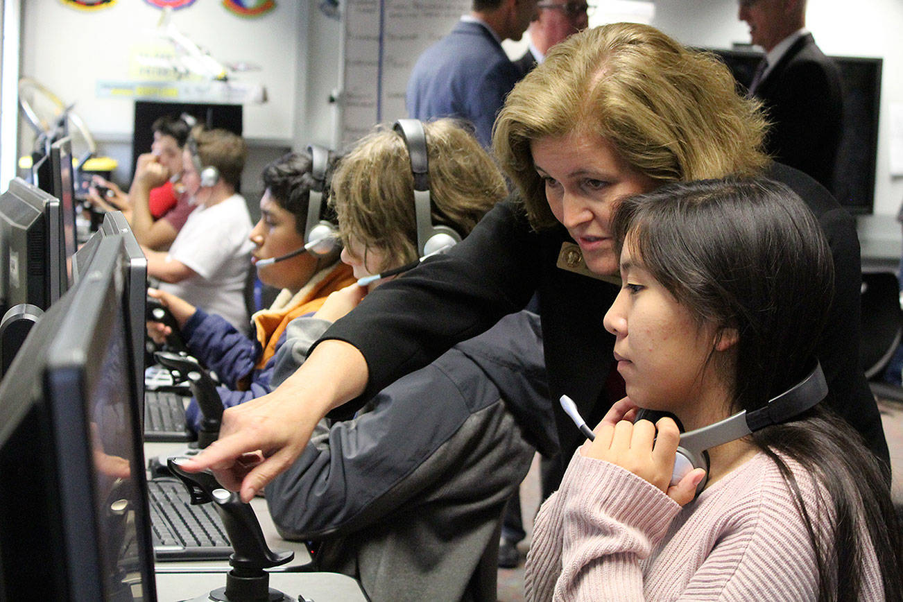 Sen. Christine Rolfes, D-23rd District, asks a Ridgetop Middle School student about the                                aviation program she’s using in class. Michelle Beahm/Kitsap News Group