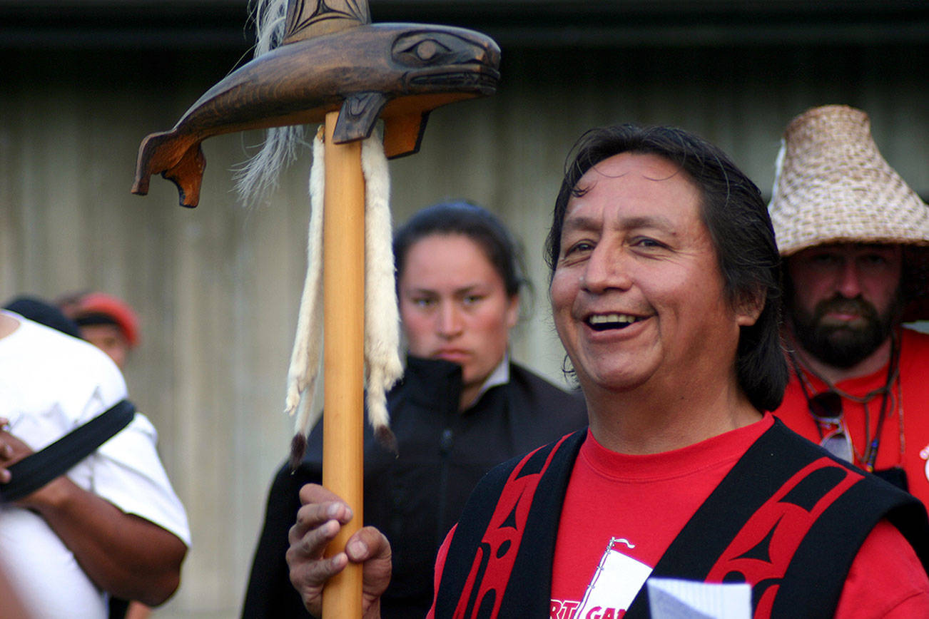 Dennis Jones of the Port Gamble S’Klallam Tribe holds a speaker’s staff as he shares some information during a Canoe Journey skippers’ meeting during the 2011 Canoe Journey/Paddle to Swinomish. The Central Kitsap Community Council is considering using the staff, also known as a talking stick, as a community symbol of collaboration. (Richard Walker/Kitsap News Group 2011)