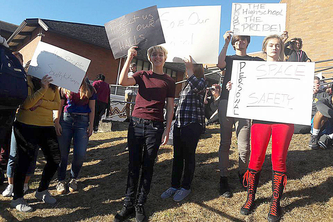 Students protest overcrowding at South Kitsap High School Sept. 15 at a pep rally. Their signs proclaim “Protect us in our halls,” “Personal space, personal safety,” “Double the high school, double the pride” and more.                                SKHS student Rhiannan Elizabeth / Courtesy