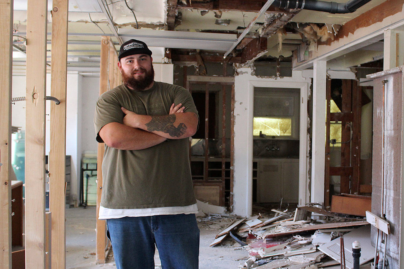 Sean Delaire, founder of Left Right Straight, works on the complete renovation of the nonprofit’s new headquarters. Michelle Beahm/Kitsap News Group