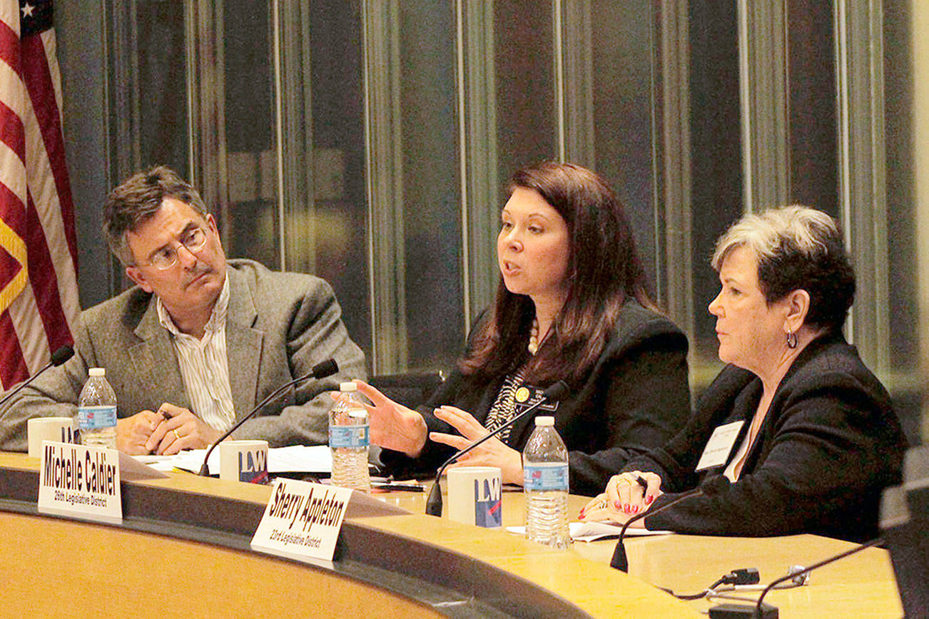 Nick Twietmeyer | Kitsap News Group                                Kitsap News Group Managing Editor Richard Walker moderates the League of Women Voters discussion, “Finding Common Ground,” featuring state representatives Michelle Caldier and Sherry Appleton.