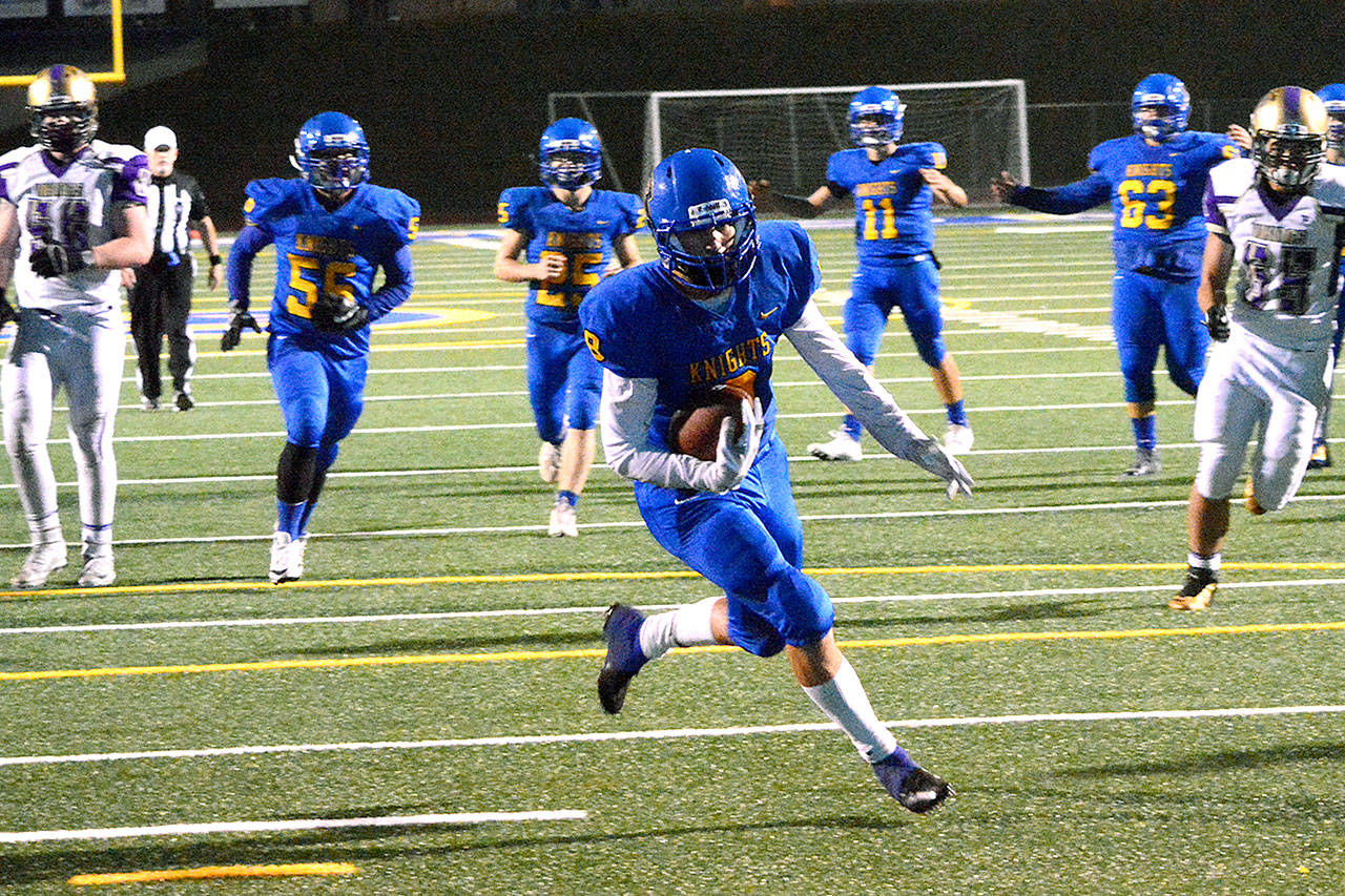 Bremerton’s Savante Perrigo takes a pass from quarterback Max Boekenoogen and scores the Knights’ only touchdown of the game. (Mark Krulish/Kitsap News Group)