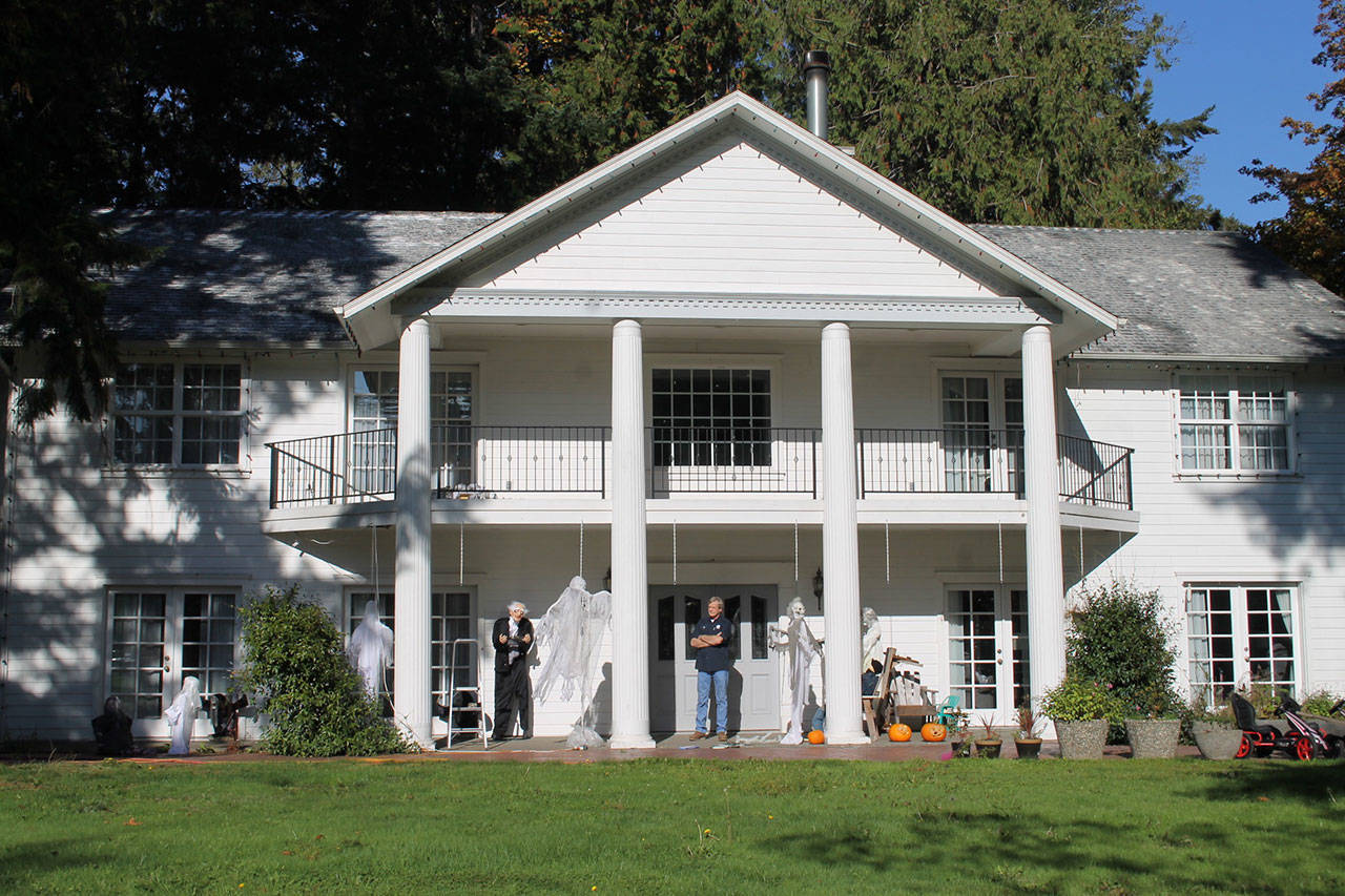 Del Mueller stands in front of his home, decorated with halloween dummies and ghosts to spook any trick-or-treaters.                                Nick Twietmeyer | Kitsap News Group