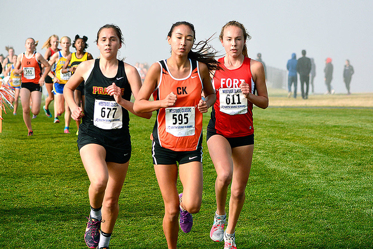 Central Kitsap freshman Maya Nichols leads the pack on her way to winning a district championship. She finished with a time of 18:53.60. Mark Krulish/Kitsap News Group