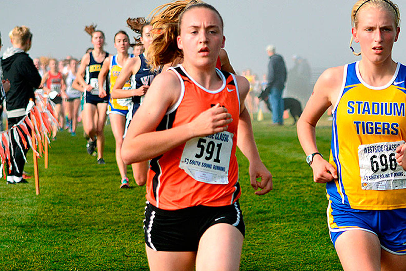 Central Kitsap’s Molly Fischer runs as part of a pack at the district meet on Oct. 28. She finished in 13th at the state meet in Pasco on Nov. 4. (Mark Krulish/Kitsap News Group)