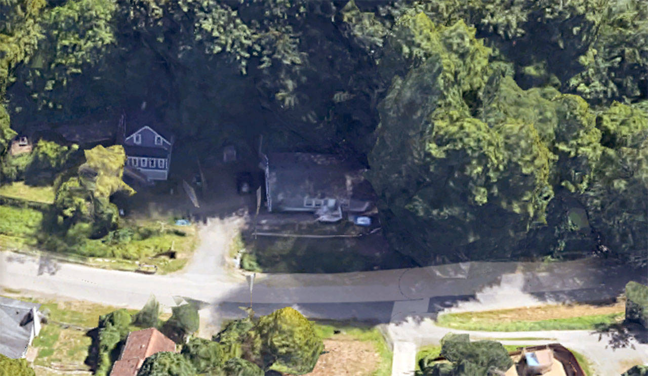 A tree reported fell into this house in Port Orchard today, trapping a child. (Google Maps)