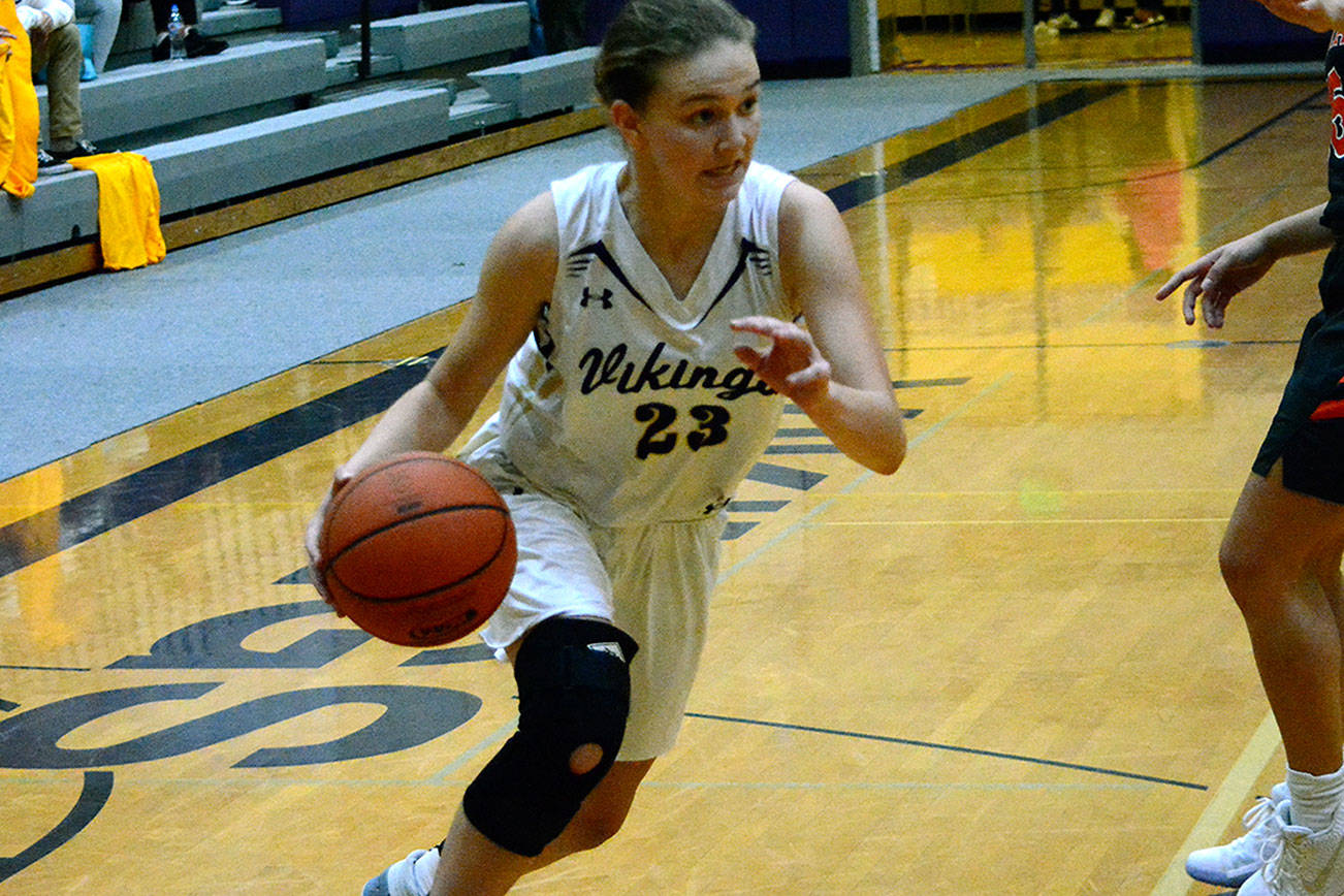 North Kitsap guard Raelee Moore drives the lane against Central Kitsap. Moore scored 23 points in her team’s Opening Day victory. (Mark Krulish/Kitsap News Group)