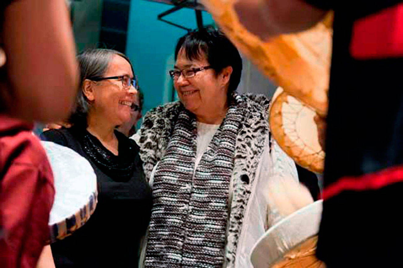 From left, Cindy Webster-Martinson is greeted at her swearing-in four years ago by her mother, Marilyn Wandrey, at the North Kitsap School District offices. (File photo)