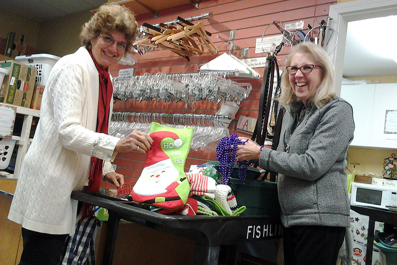 From left, Fishline volunteers Linda Drew Fritz and Jean Haller sort donated items before Second Season Thrift Store opens Dec. 6. The thrift store is moving from 2,000-square-foot space on Anderson Parkway to a 5,000-square-foot site in Poulsbo Village. (Richard Walker/Kitsap News Group)