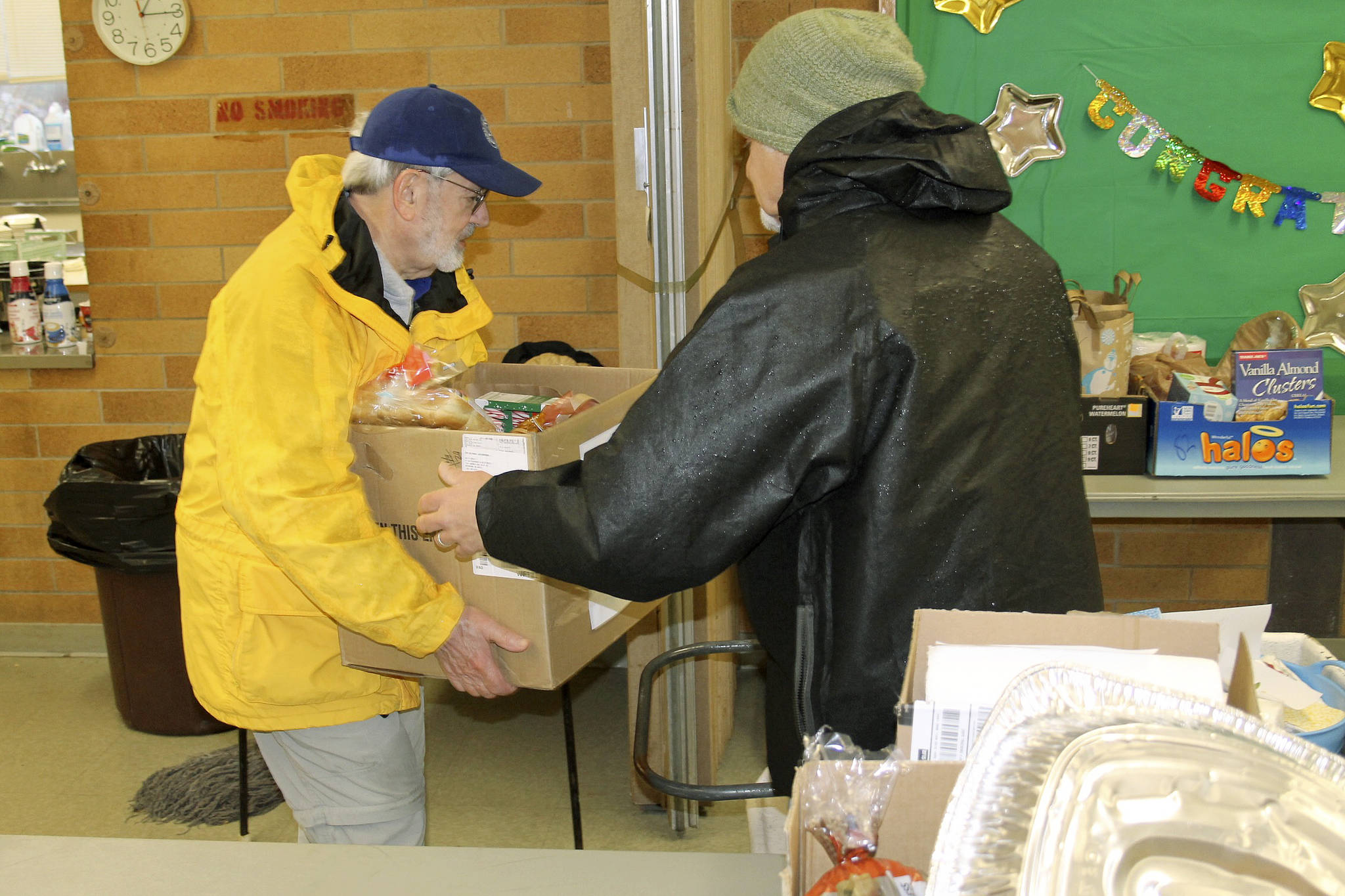 Volunteers at St. Vincent dePaul perpare to hand out food for the holidays.                                Nick Twietmeyer | Kitsap News Group