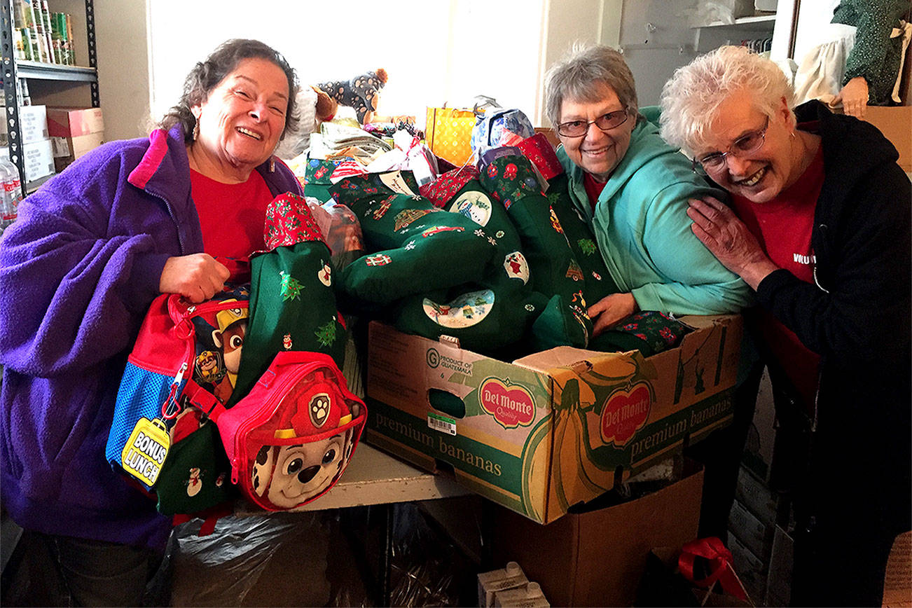 Kingston Cove Yacht Club members make, stuff stockings with love