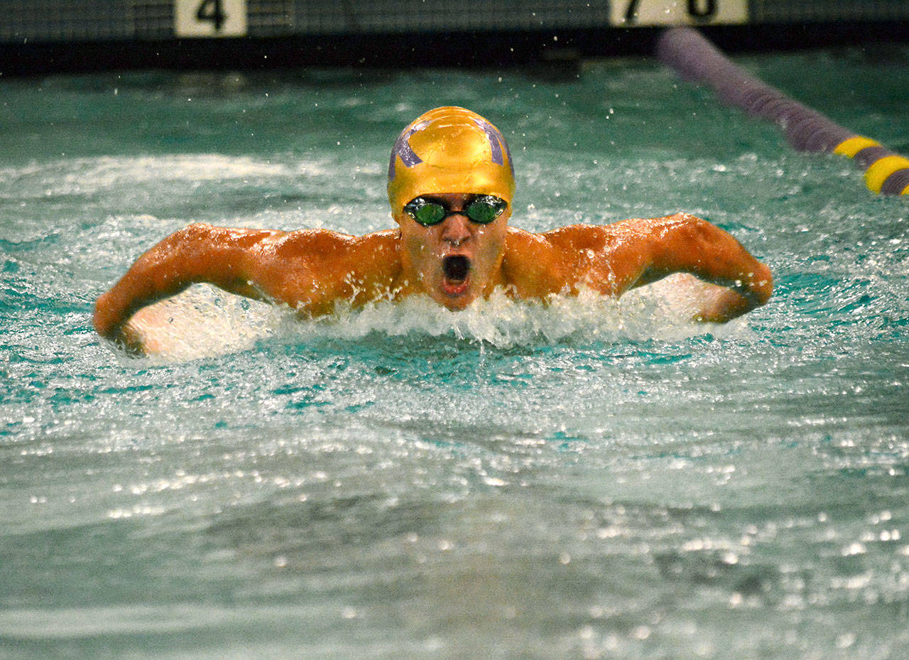 North Kitsap’s Morgan Chapman races in the 100 yard butterfly in a dual meet against Kingston on Dec. 12. Chapman’s time of 1:02.93 qualified him for the district meet. (Mark Krulish/Kitsap News Group)