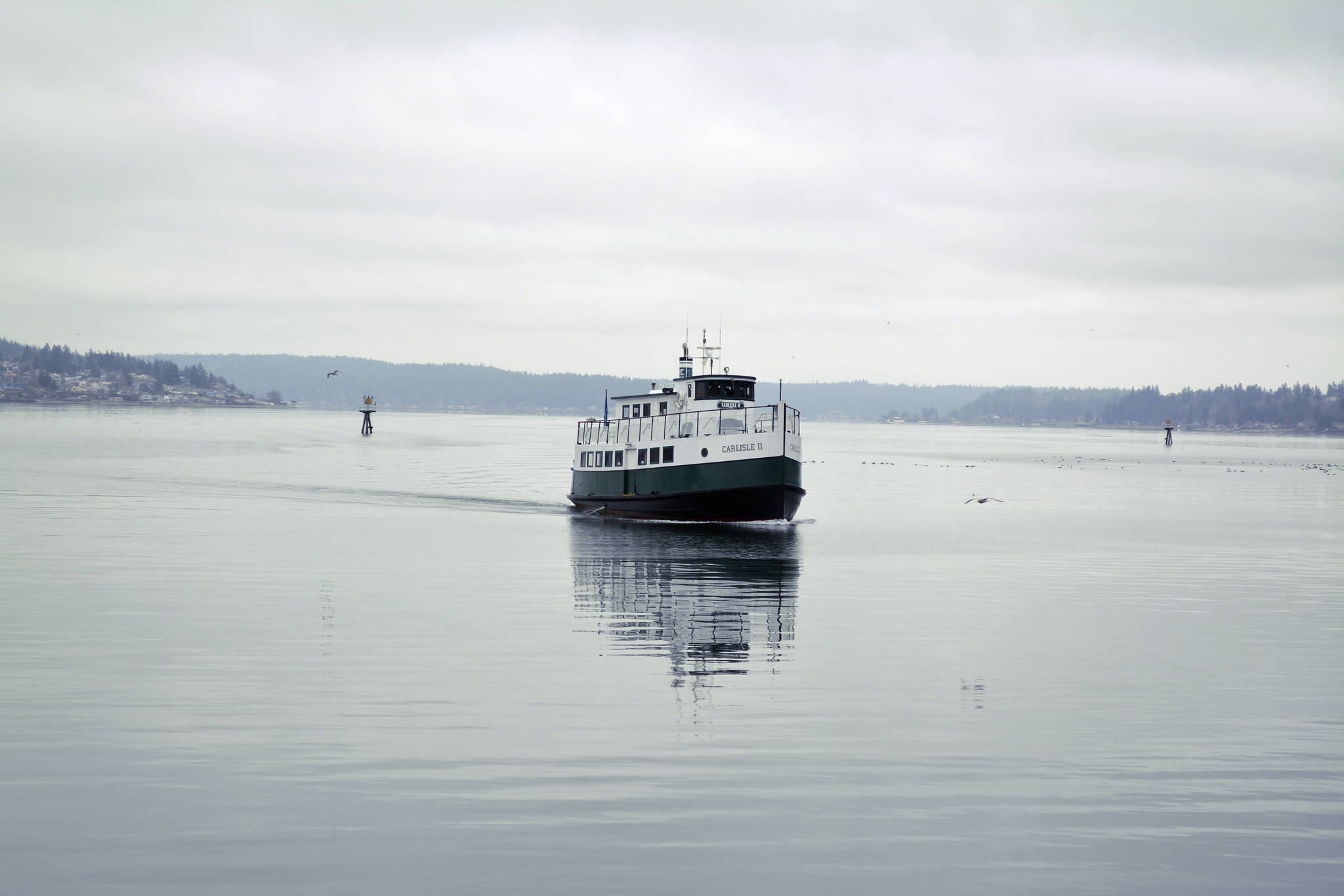 The Carlisle II, a foot ferry between downtown Port Orchard and downtown Bremerton arrives at the Port Orchard docks. (Mark Krulish/Kitsap News Group)