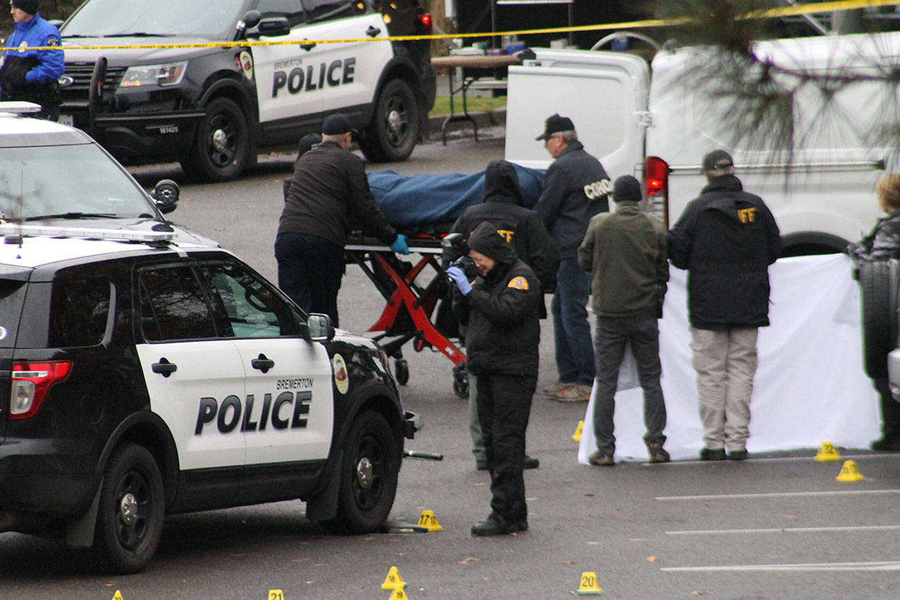 Bremerton Police officers and crime scene investigators examine the scene of an early morning shooting Dec. 17 between two officers and a 53-year-old man. Nick Twietmeyer/Kitsap News Group.