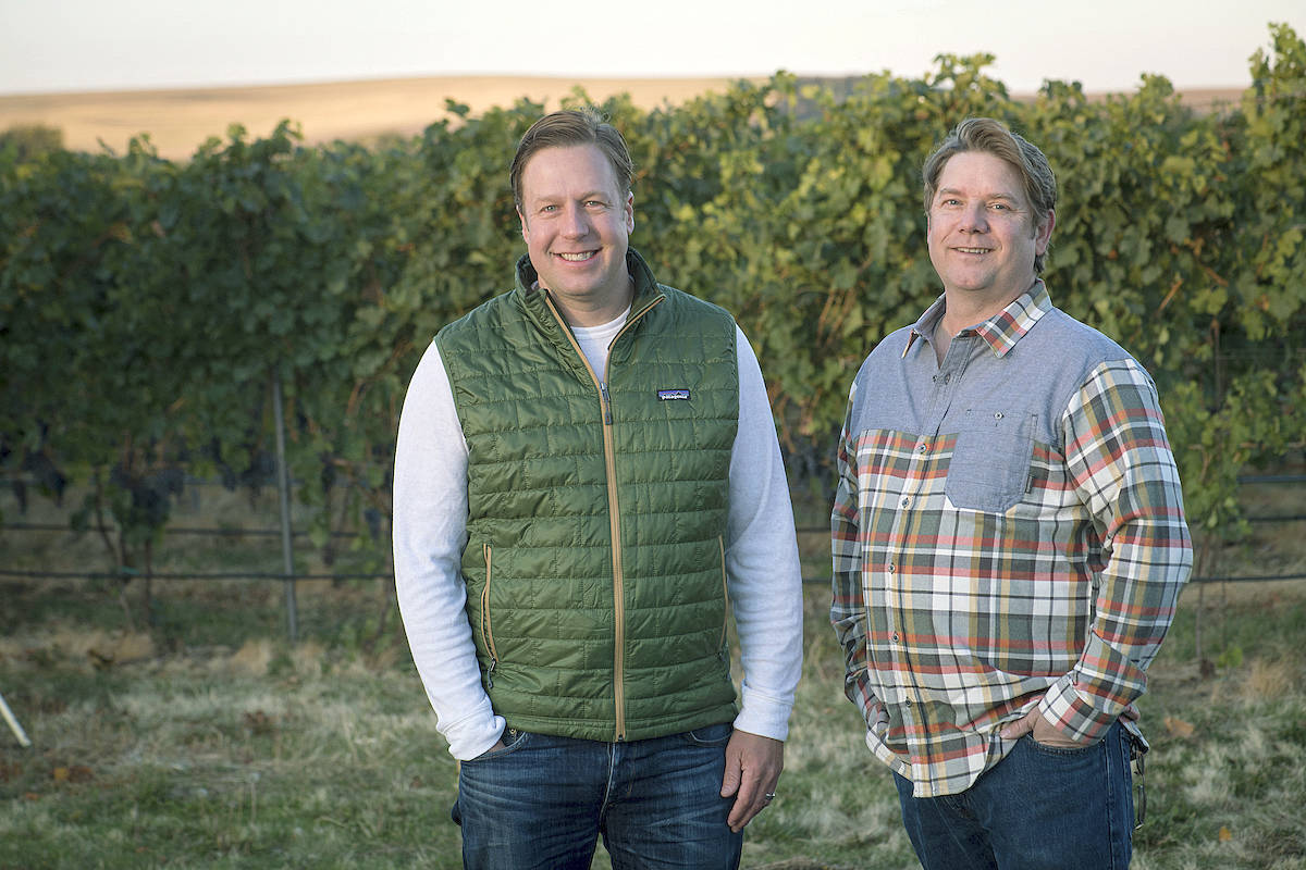Portland’s Scott Haladay, left, and his family purchased Walla Walla Vintners last winter, and talented winemaker William vonMetzger, right, remains in the cellar of the iconic red barn. (Photo courtesy of Walla Walla Vintners)