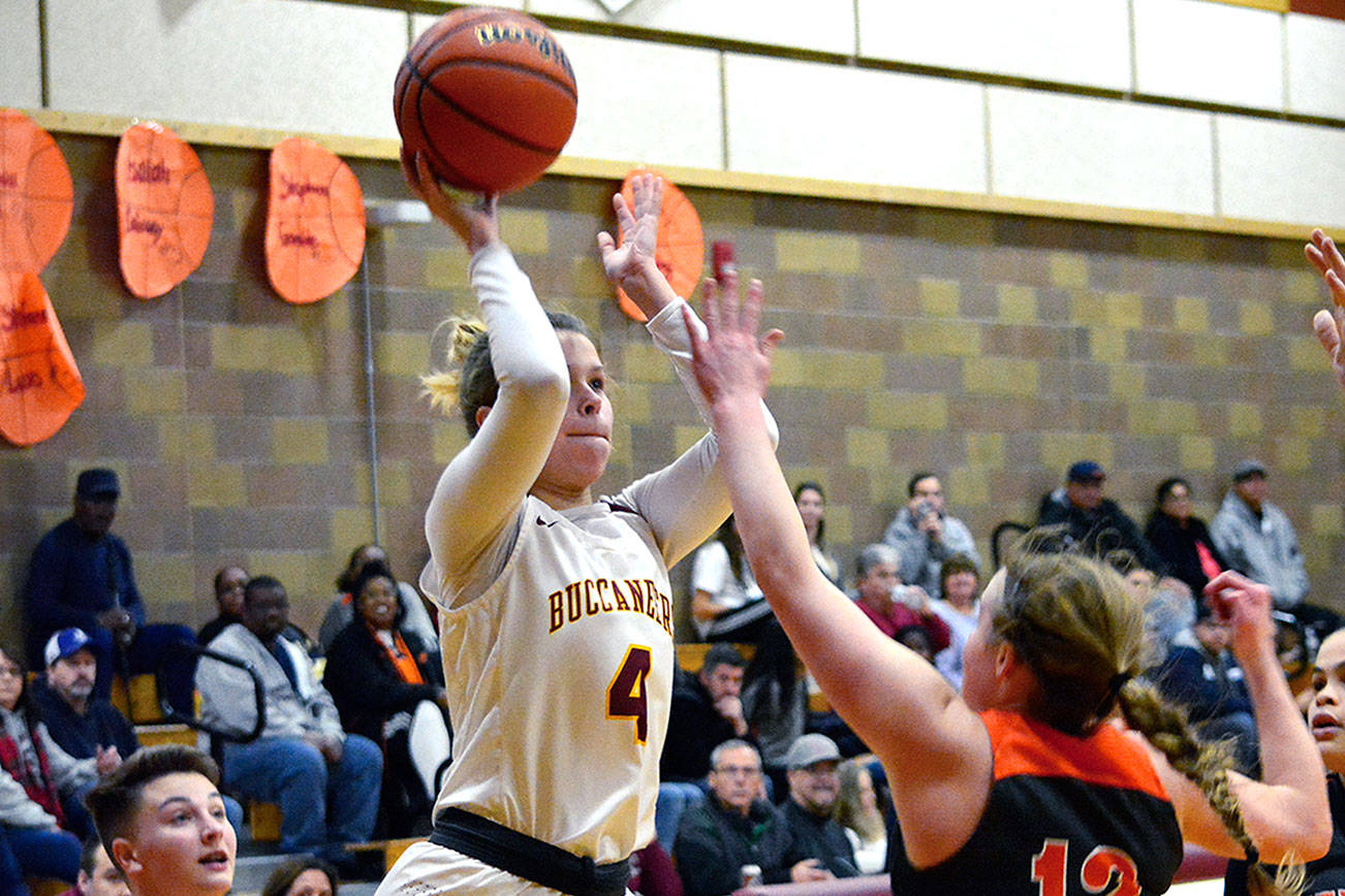 &lt;em&gt;Kingston senior Avy Hiner (4), lets go of a shot as she’s surrounded by Central Kitsap defenders in her team’s 59-49 victory on Dec. 20.&lt;/em&gt;Mark Krulish/Kitsap News Group