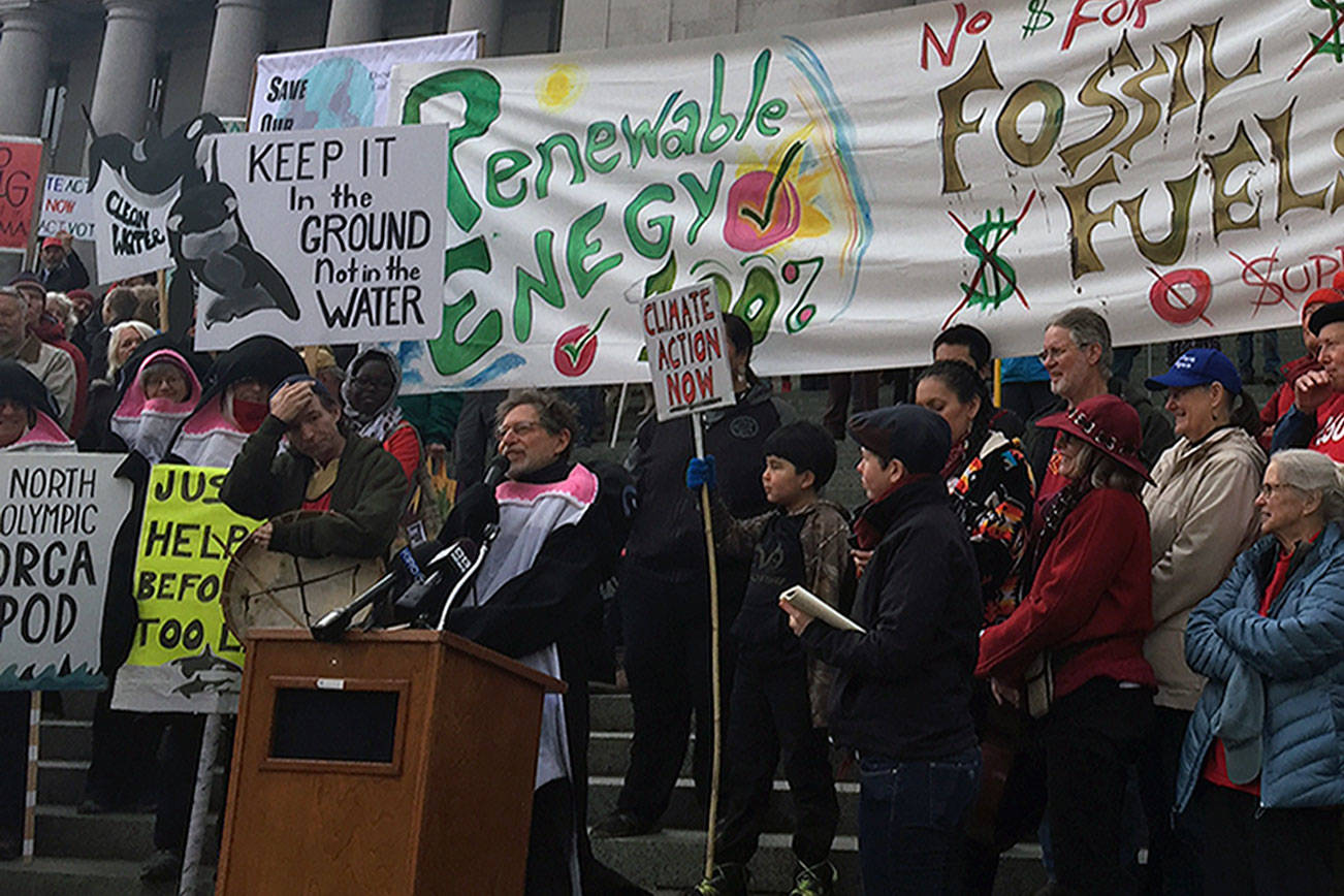 Climate groups demand the state government uphold treaty rights, stop liquified natural gas construction in Tacoma, and abolish open-pen fish farms that they say endanger native salmon and other fish, Jan. 8 in Olympia. (WNPA Olympia News Bureau)