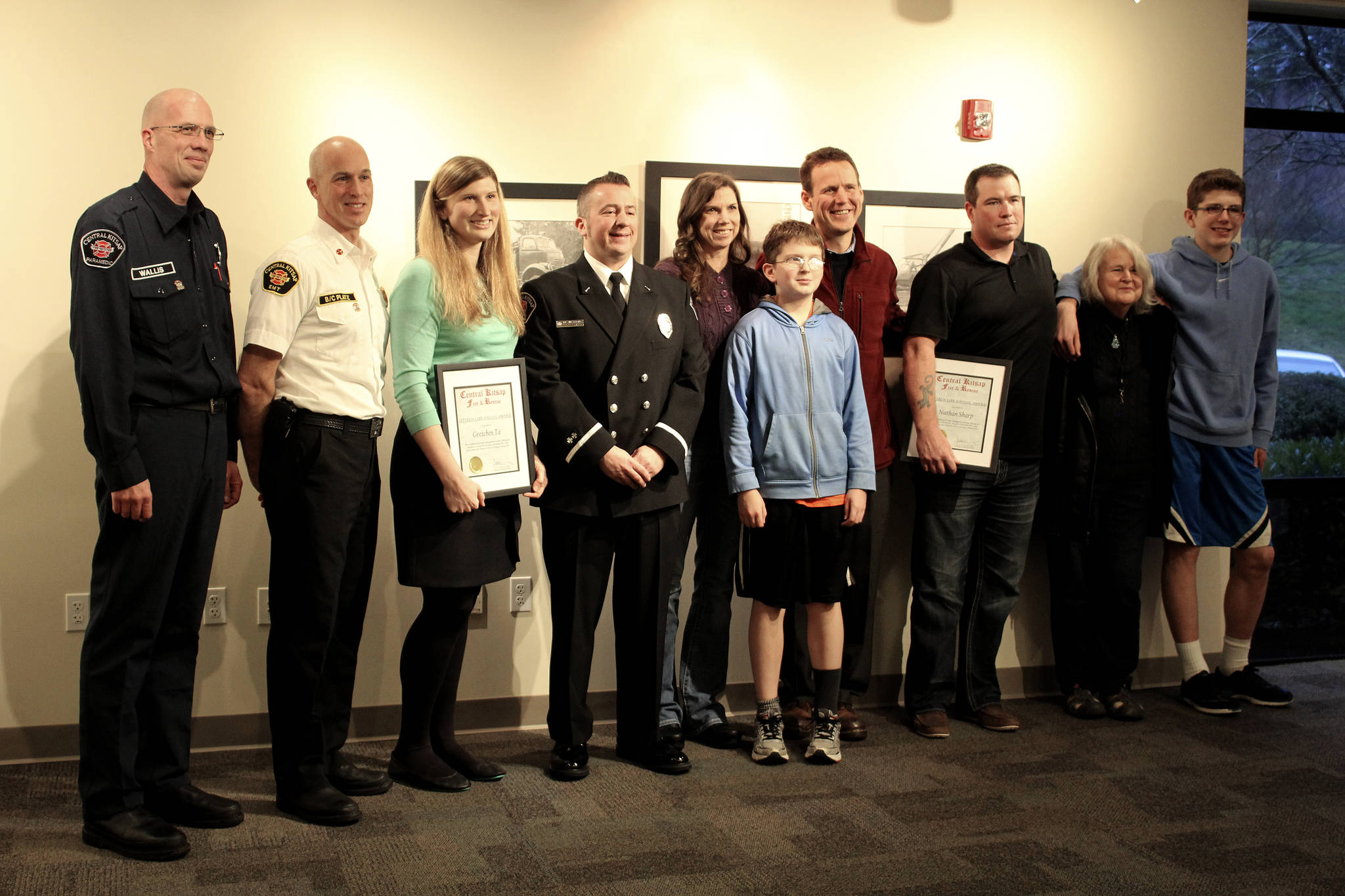 Central Kitsap Fire and Rescue awarded Gretchen Ta and Nathan Sharp Citizen Life-Saving Awards Jan. 8 for their efforts Nov. 23 to help Tom Wilkinson in the Turkey Trot.                                Michelle Beahm / Kitsap News Group
