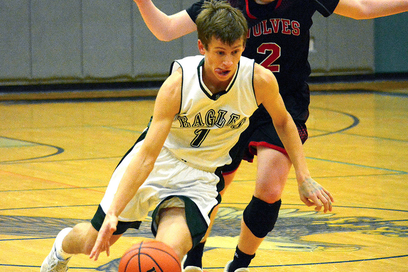 &lt;em&gt;Klahowya’s Jacob Kraft (1) slips by a Coupeville defender. His team picked up an important 51-37 win over the Wolves on Jan. 16.&lt;/em&gt; Mark Krulish/Kitsap News Group