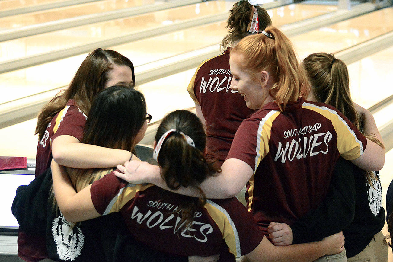 Mark Krulish | Kitsap News Group                                The South Kitsap bowling team stood together to cheer each other on during the Baker games at the West Central District III Tournament on Jan. 27.