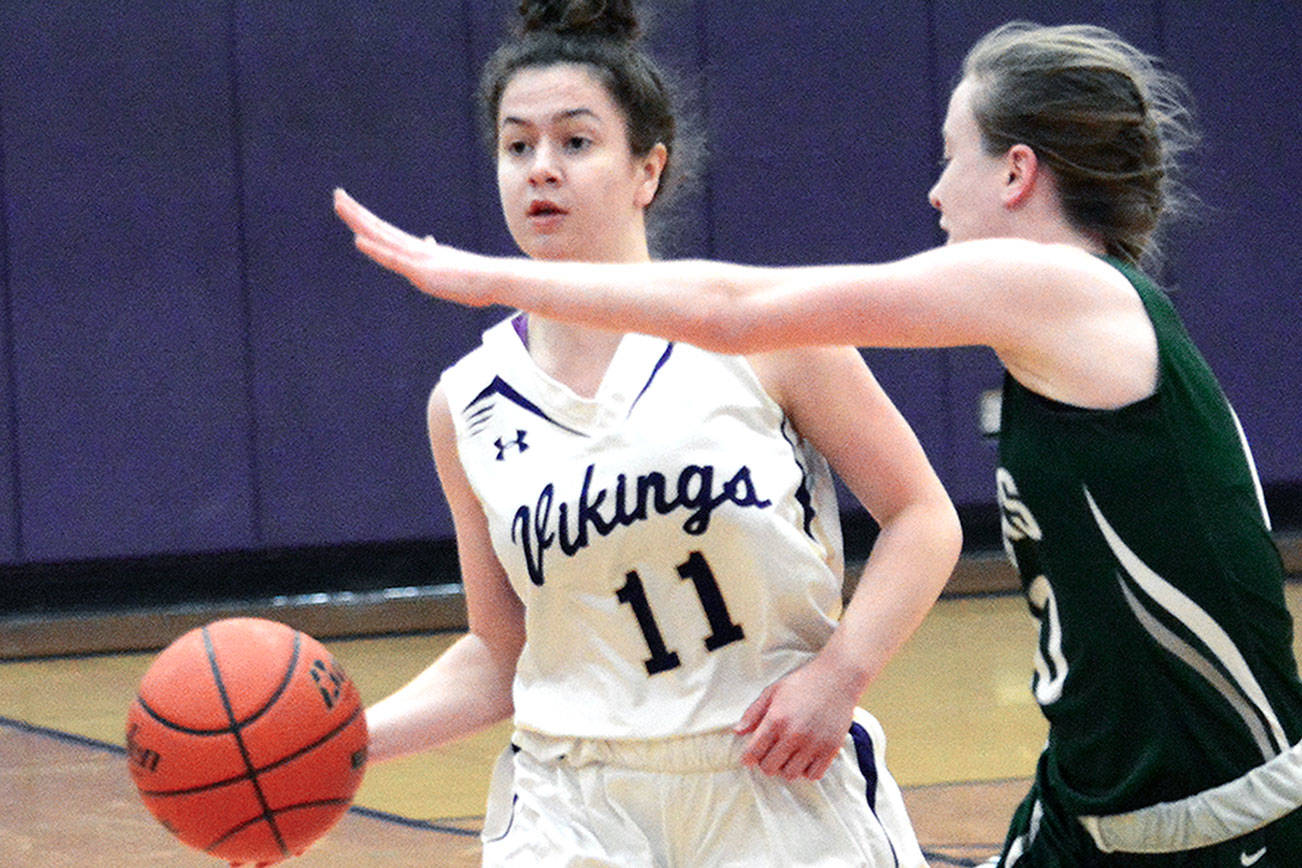 North Kitsap’s Lauren Weins makes a pass to the wing in her team’s 54-48 loss to Port Angeles. (Mark Krulish/Kitsap News Group)