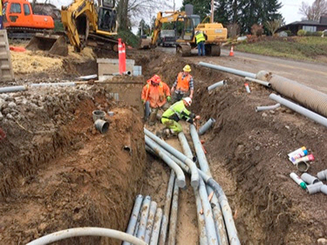 Because of recent rains, crews encounter muddy conditions in the joint utility trench that is being installed as part of the Silverdale Way Road Improvement Project. (Kitsap County Public Works)