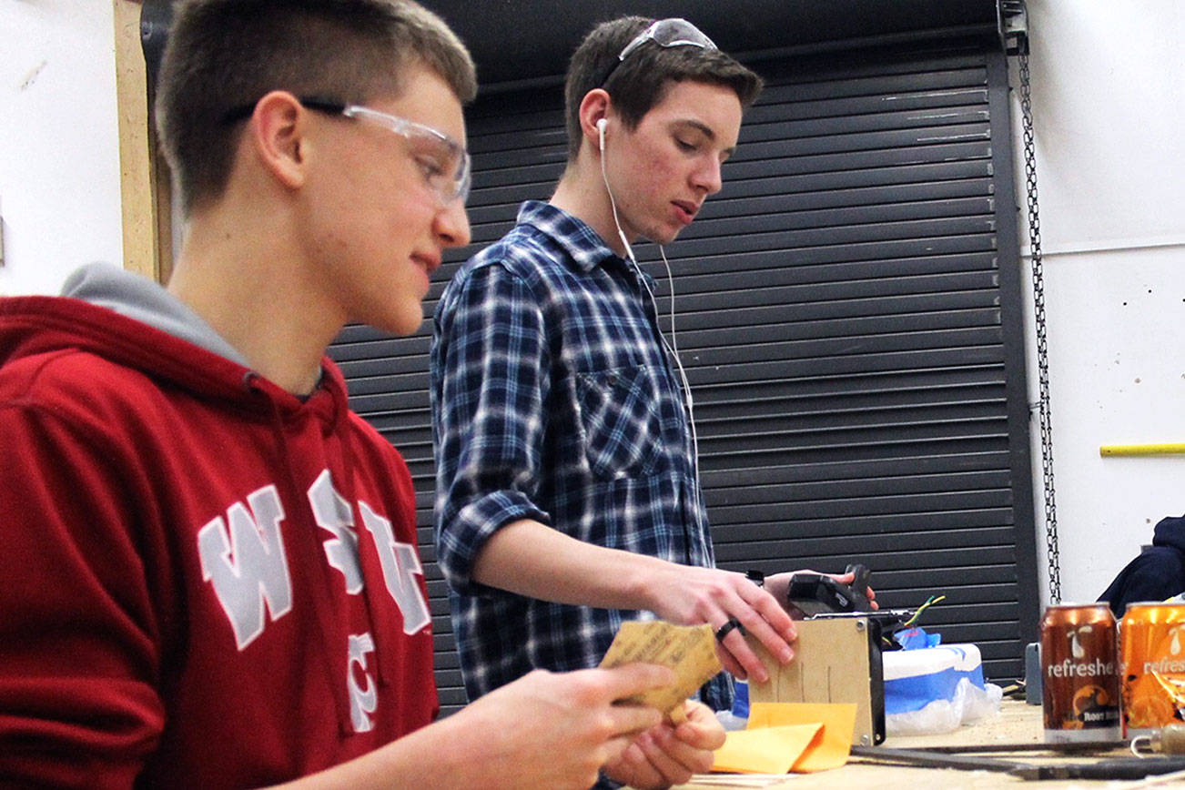 From left, North Kitsap High School seniors Donovan LeRoy and Ethan Rhodes work on their projects during a Jan. 30 after-school CTE shop session at NKHS. Jacob Moore/Kitsap News Group