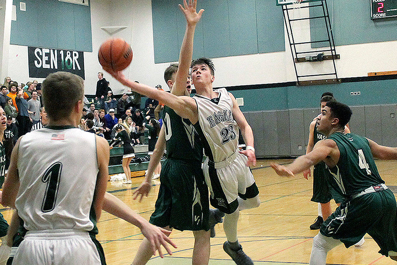 Klahowya’s Gabriel Smith extends past the Vashon Island defense in his team’s district game on Feb. 9. The Eagles season came to an end with a 52-42 loss. (Jacob Moore/Kitsap News Group)