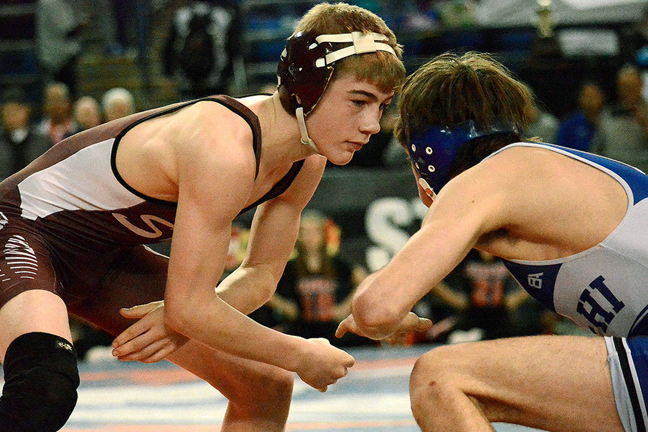 South Kitsap’s Xavier Eaglin, a freshman, won his first state championship at Mat Classic XXX in the 106 pound division. He was part of an effort that helped the Wolves net the overall 4A team title. (Mark Krulish/Kitsap News Group)