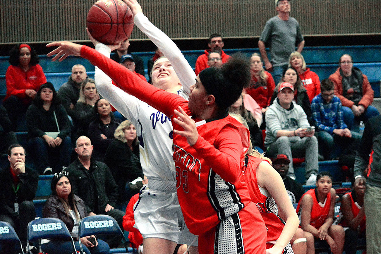 Junior guard Raelee Moore led North Kitsap with 16 points in their regional win over Renton. The Vikings have qualified for the state tournament for the first time since 1988. (Mark Krulish/Kitsap News Group)