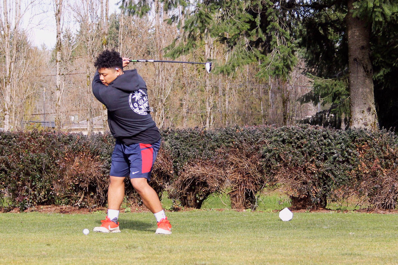Senior golfer Allen Ignacio in full swing during a March 9 practice at Rolling Hills Golf Course. Head coach Miles Hemmersbach said Ignacio is a top returning athlete this season. Jacob Moore | Kitsap News Group