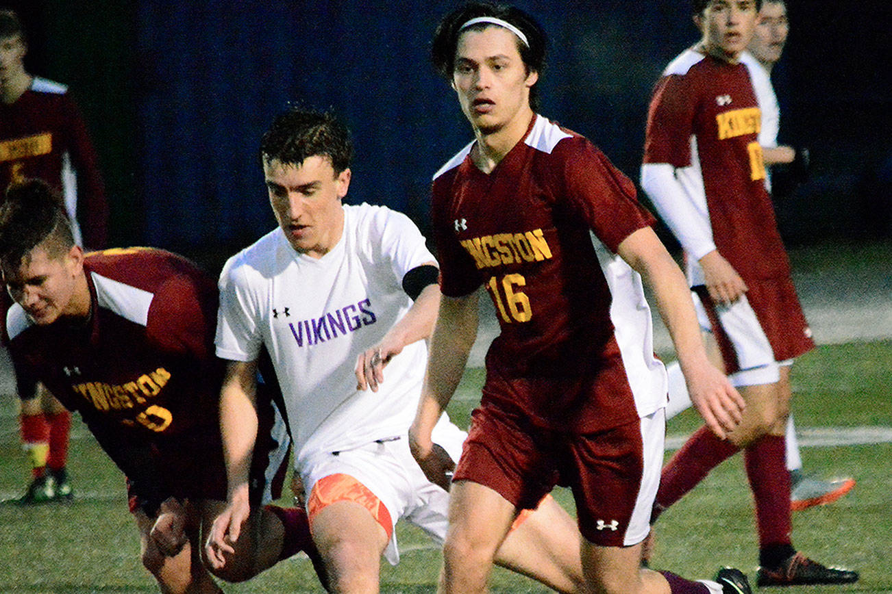 Kingston’s Jordan Sanchez looks upfield for a pass in his team’s 1-0 victory over North Kitsap on March 12. (Mark Krulish/Kitsap News Group)