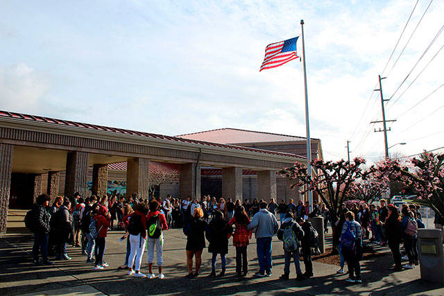 Bremerton High School students gather around the campus flagpole in protest of gun violence. Photo by Michelle Beahm