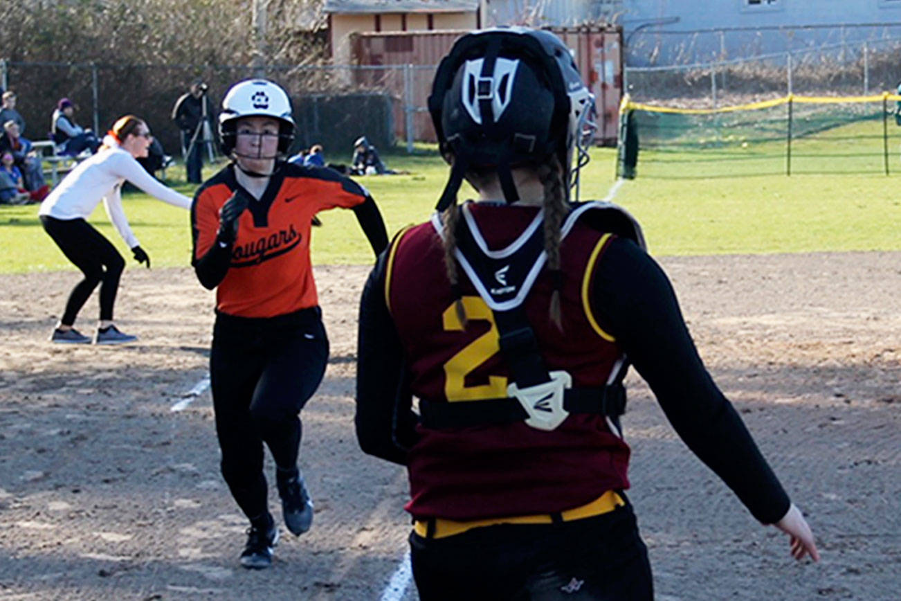 Senior Zee Young comes home on a single by freshman Brooke Mimaki in the first inning of Central Kitsap’s game against Kingston on March 15. (Jacob Moore/Kitsap Daily News)
