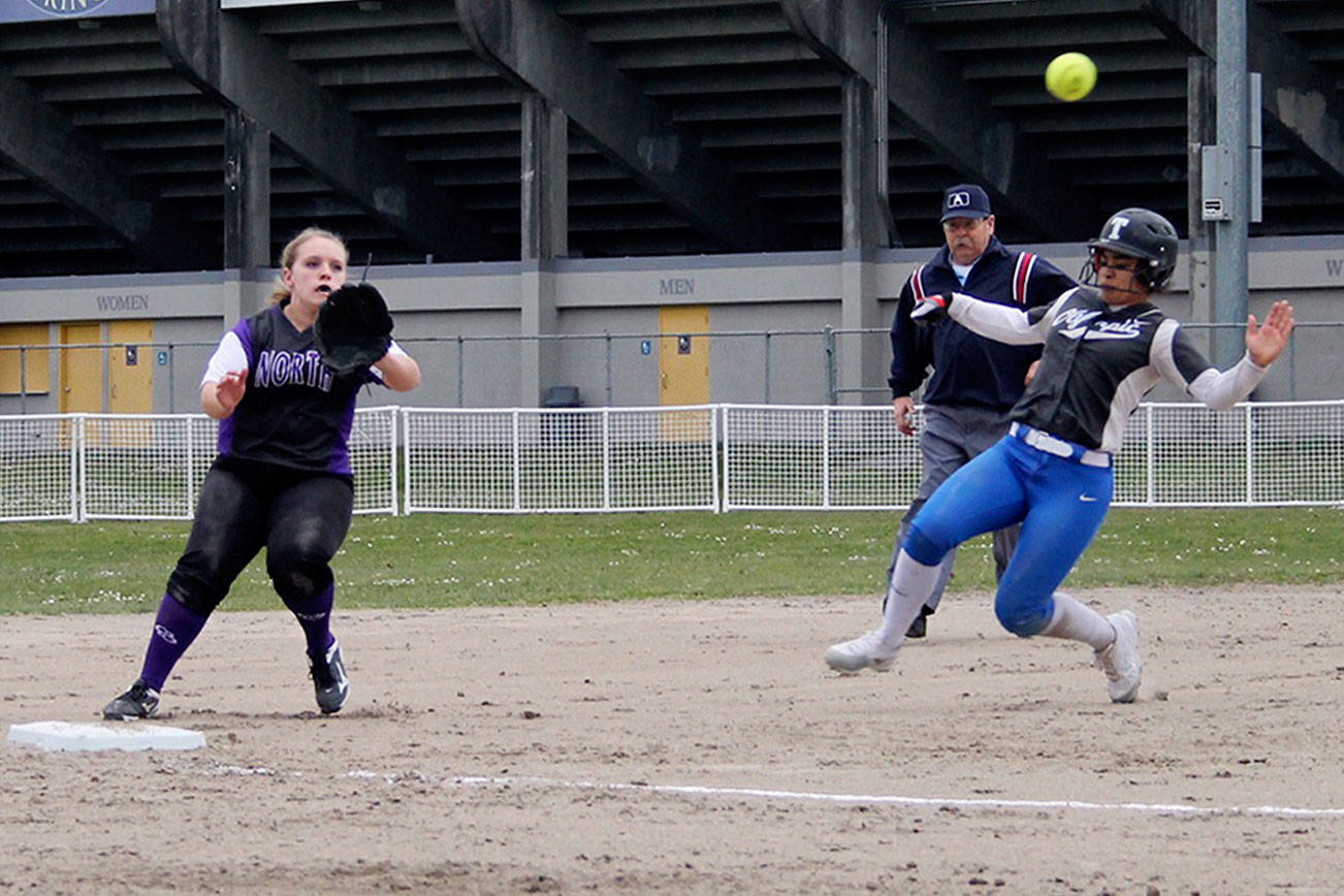 &lt;em&gt;Vikings junior infielder Makenzie Wagner hustles to third base to get a tag down on Trojans senior Kiki Mitchell, who is stealing. She totaled four steals in the game.&lt;/em&gt;                                Jacob Moore / Kitsap Daily News