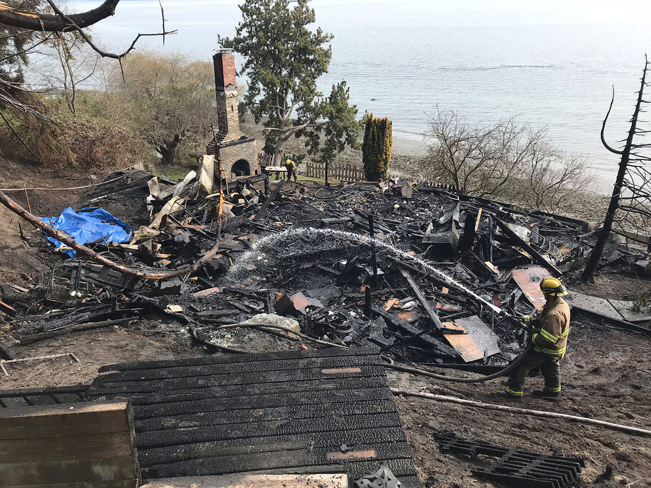 Lack of accessibility, nearby fire hydrant and late detection all contributed to a fire which completely engulfed a waterfront cabin in Kingston on March 30. Courtesy Michele Laboda, North Kitsap Fire & Rescue.